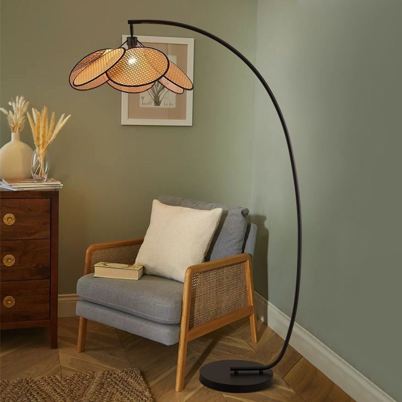 Wicker floor lamp with fishing design, perfect for living room, stylish and decorative, ideal for use next to a sofa.