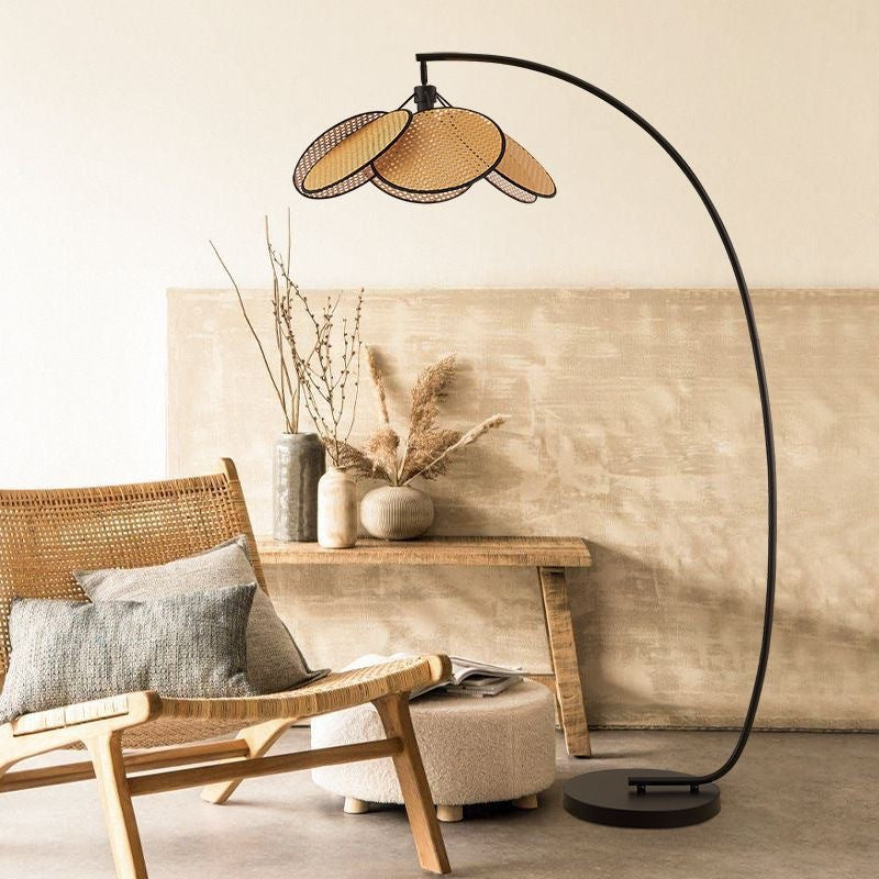 Wicker floor lamp with fishing design, perfect for living room, stylish and decorative, ideal for use next to a sofa.